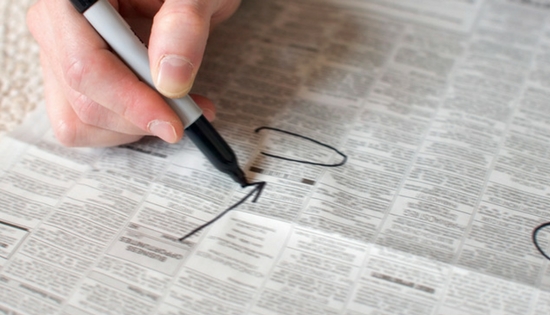 Circling jobs in newspaper classifieds
